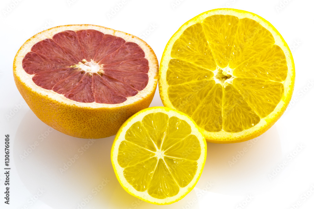 Fresh orange, grapefruit, lemon on a white Fresh orange, grapefruit, lemon on a white