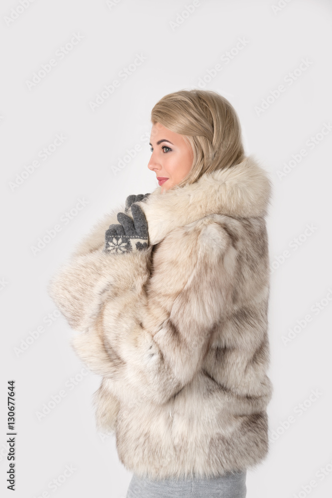portrait of the young woman in a fur coat portrait of the young woman in a fur coat