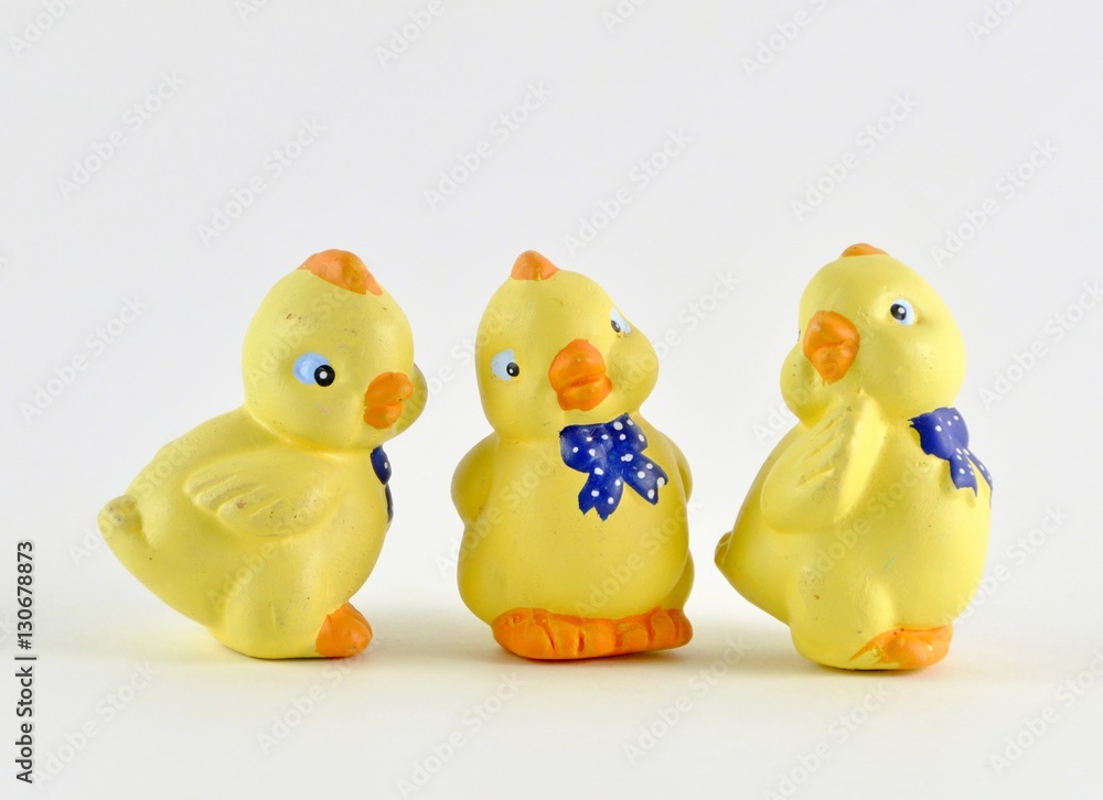 group of ceramic Easter chicks on light background group of ceramic Easter chicks on light background