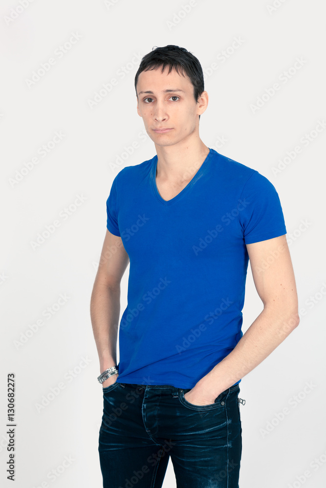 Handsome man doing different expressions in different sets of clothes: hands in pockets Handsome man doing different expressions in different sets of clothes: hands in pockets