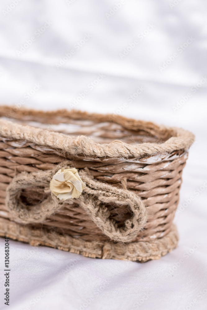 Obraz premium Woven retro rustic brown basket for flower decorations