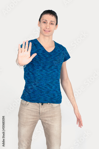Obraz na płótnie Handsome man doing different expressions in different sets of clothes: stop sign