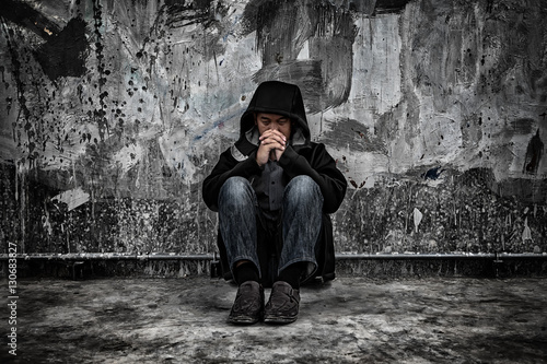 Drug abuse concept., overdose asian male drug addict with problems, man in hood with frustrated depression. photo