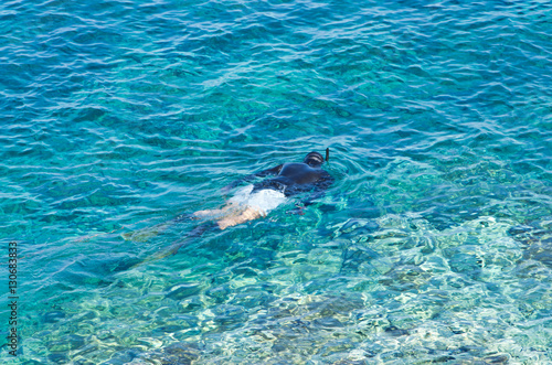 Diver or snorkler at Aegean sea near small greek island, Macedonia, Greece