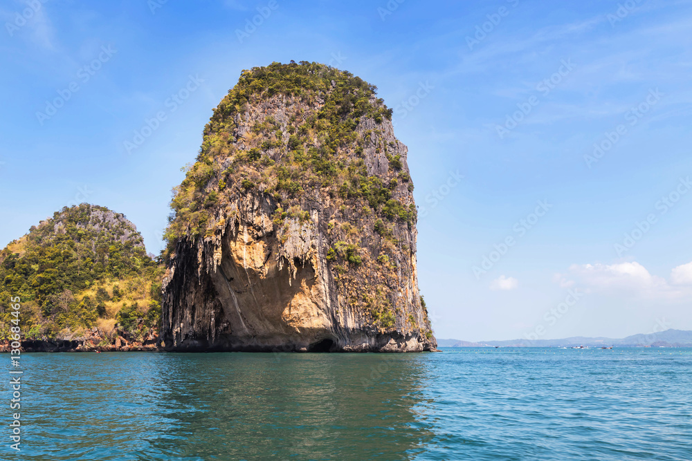 Small limestone island in andaman sea at Railay beach krabi Thailand
