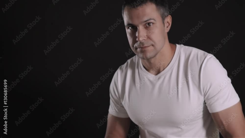 Portrait of handsome man who is holding a wrench at home and smiling Portrait of handsome man who is holding a wrench at home and smiling