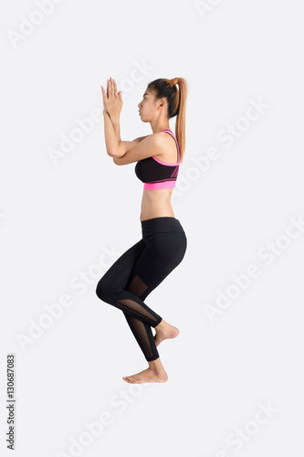 Young woman in yoga pose.