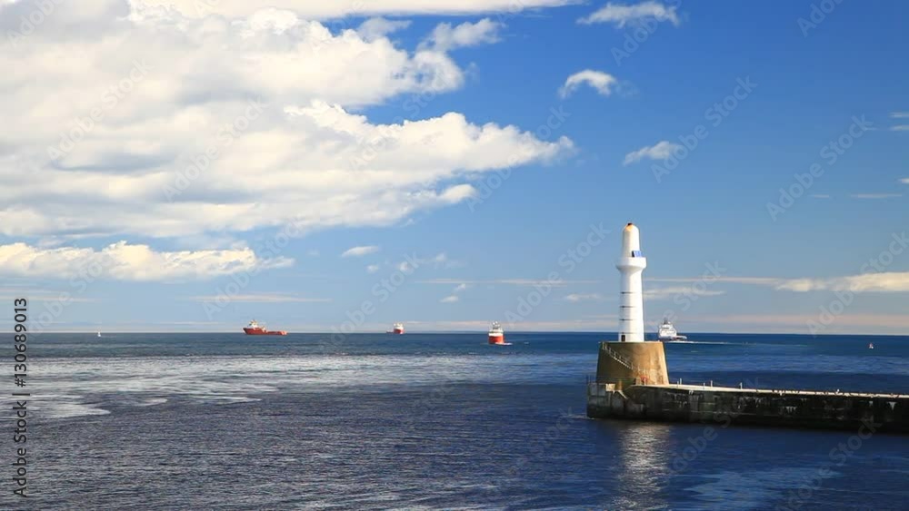 Lighthouse and Shoreline with a Supply Boat in Aberdeen, Scotland on Sunny Day
Lighthouse and Shoreline with a Supply Boat in Aberdeen, Scotland on Sunny Day