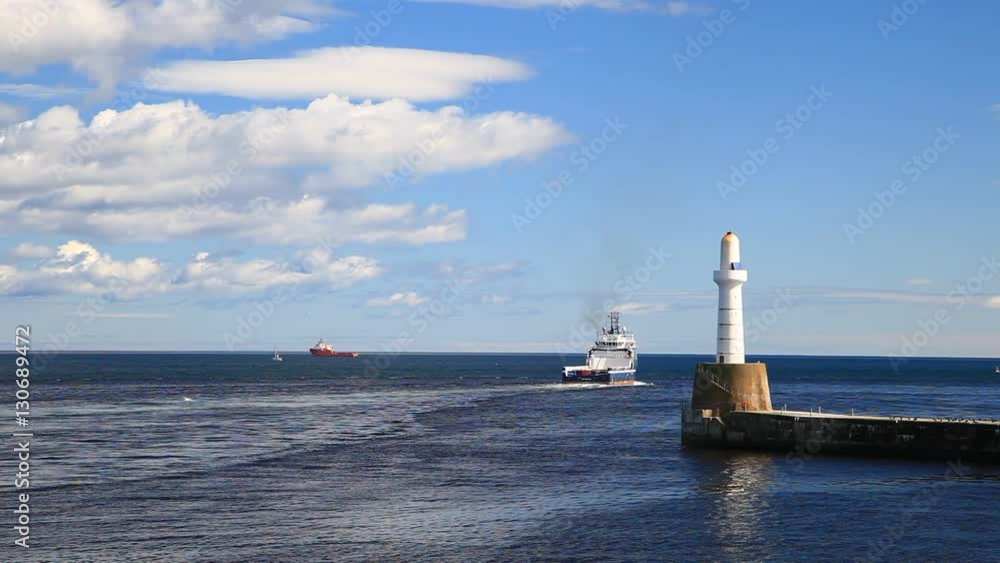 Lighthouse and Shoreline with a Supply Boat in Aberdeen, Scotland on Sunny Day
Lighthouse and Shoreline with a Supply Boat in Aberdeen, Scotland on Sunny Day