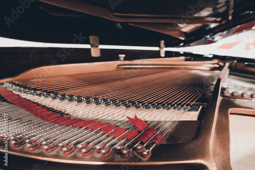 Piano strings and hammer photo