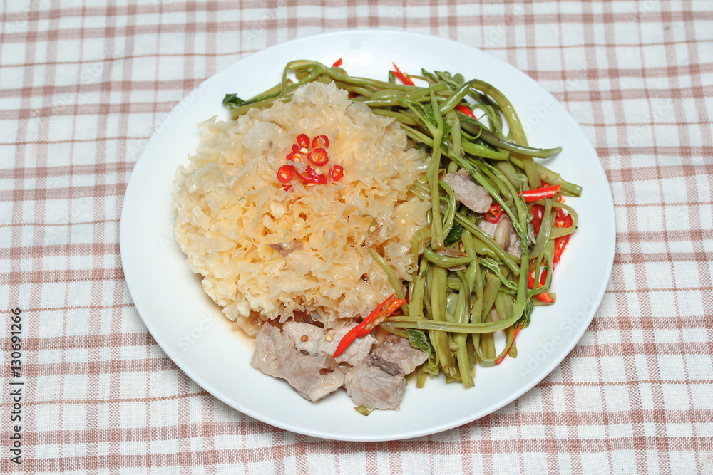 Thai spicy fried snow fungus mushroom with morning glory. Thai spicy fried snow fungus mushroom with morning glory.
