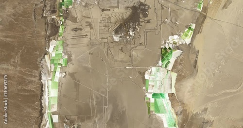 High-altitude overflight aerial of mineral evaporation ponds near Lake Qarhan, China. Clip loops and is reversible. Elements of this image furnished by USGS/NASA Landsat