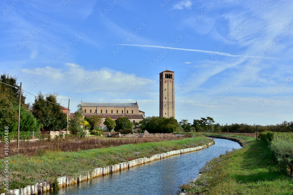 Torcello Island near Venice with ancient church and canal