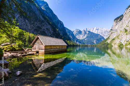 Boat dock hangar on Obersee mountain lake in Alps. Bavaria  Germany