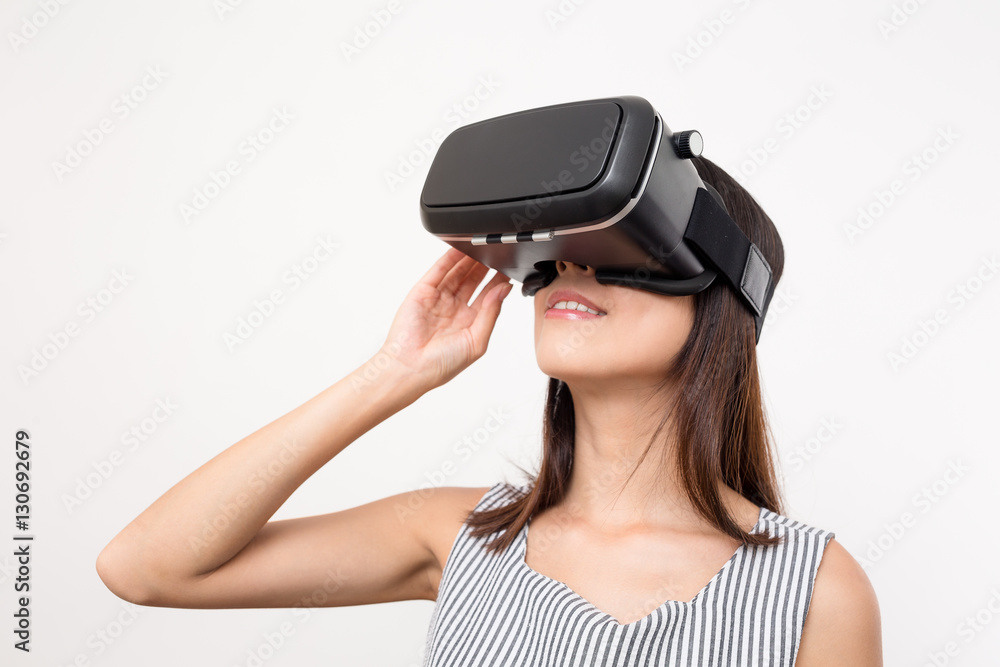 Woman using the virtual reality headset Woman using the virtual reality headset
