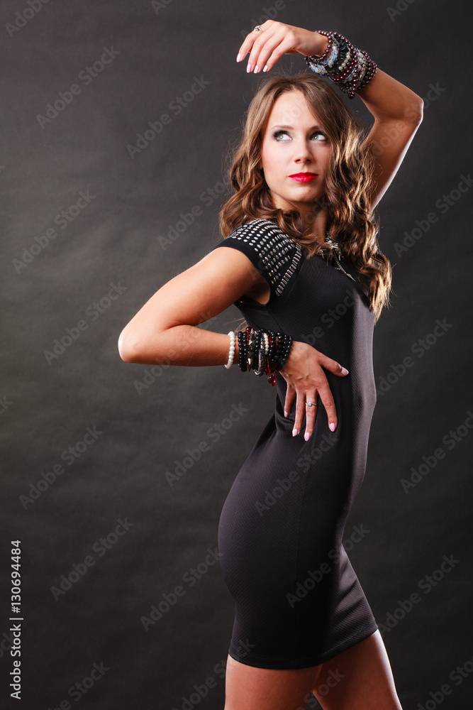 Fototapeta premium woman with jewellery in black evening dress