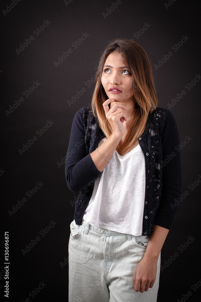 Beautiful woman doing different expressions in different sets of clothes: thinking Beautiful woman doing different expressions in different sets of clothes: thinking