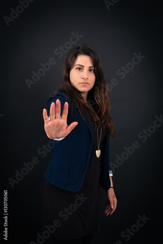 Wallpaper Mural Beautiful woman doing different expressions in different sets of clothes: stop sign Torontodigital.ca