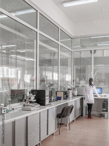 girl in an industrial laboratory tests on the quality of products