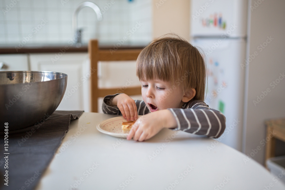 young pregnant mother with son Toddler, make dough for baking young pregnant mother with son Toddler, make dough for baking