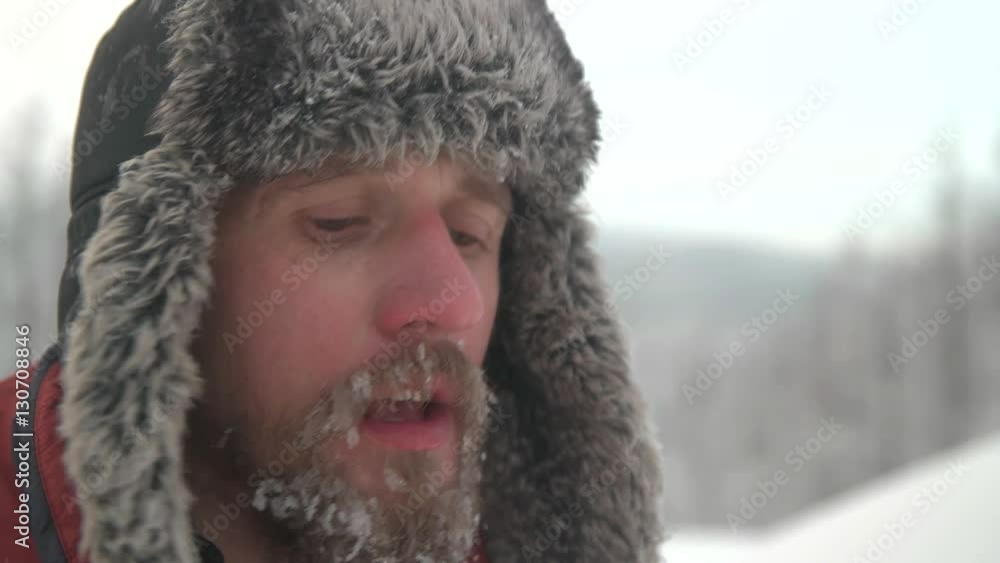 man with a beard drinking tea in winter man with a beard drinking tea in winter