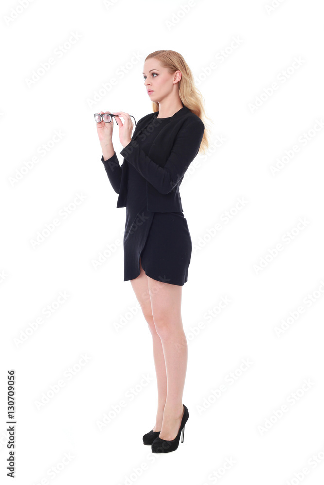 Full length portrait of an attractive professional woman wearing black dress suite and heels, isolated on a white background. Full length portrait of an attractive professional woman wearing black dress suite and heels, isolated on a white background.