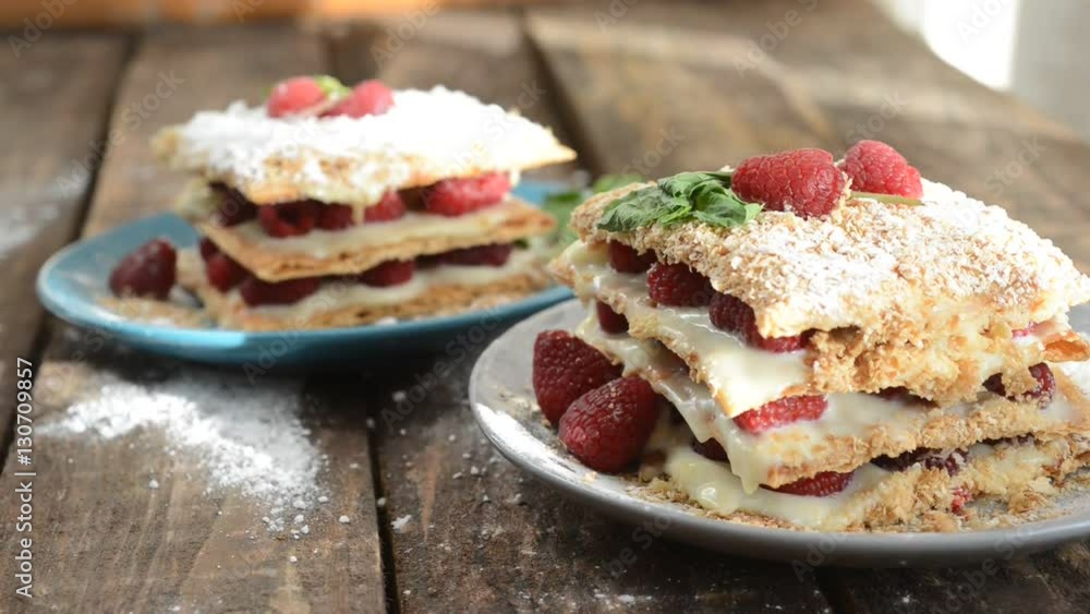 Raspberry Mille-feuille with cinnamon on dark wooden Board. Raspberry Mille-feuille with cinnamon on dark wooden Board.