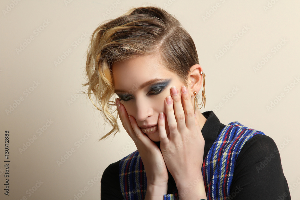 Portrait of a fashion model girl posing in a vest. Portrait of a fashion model girl posing in a vest.