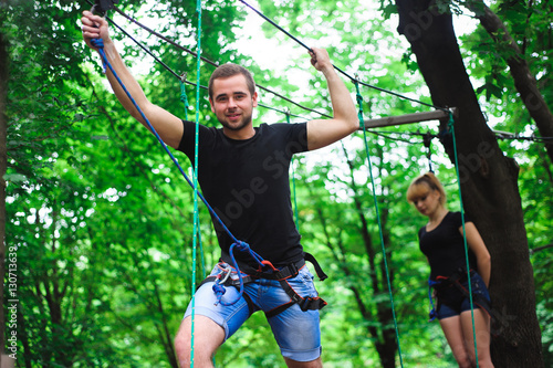 Hiking in the rope park two young people