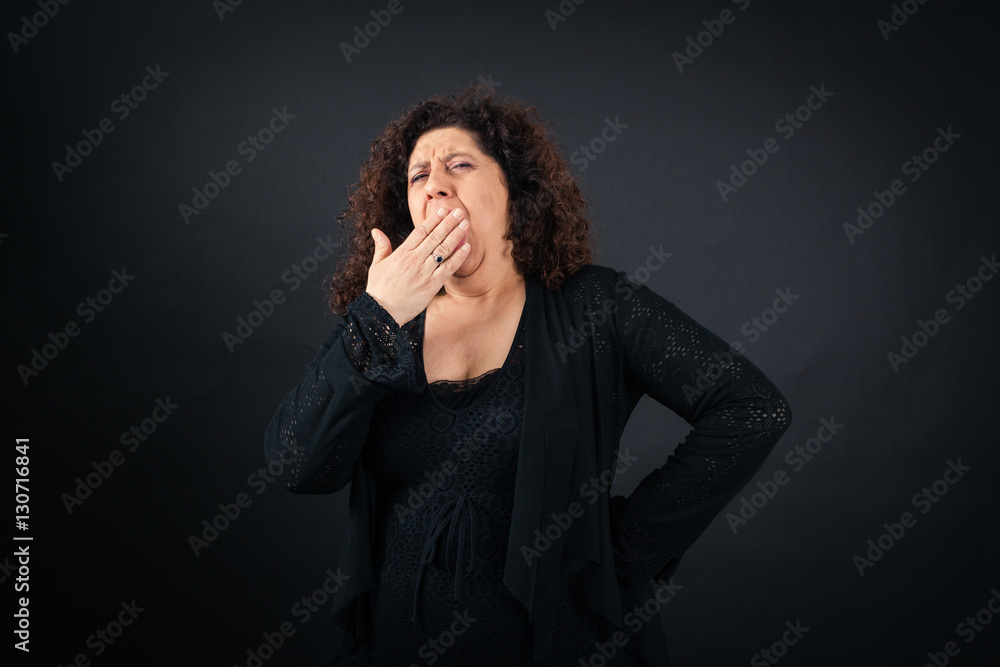 Beautiful woman doing different expressions in different sets of clothes: yawn Beautiful woman doing different expressions in different sets of clothes: yawn