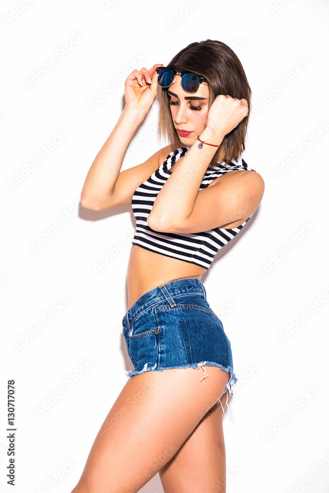 attractive beautiful woman having fun on the white wall,wearing vintage sunglasses,outfit and hat, vacation style attractive beautiful woman having fun on the white wall,wearing vintage sunglasses,outfit and hat, vacation style