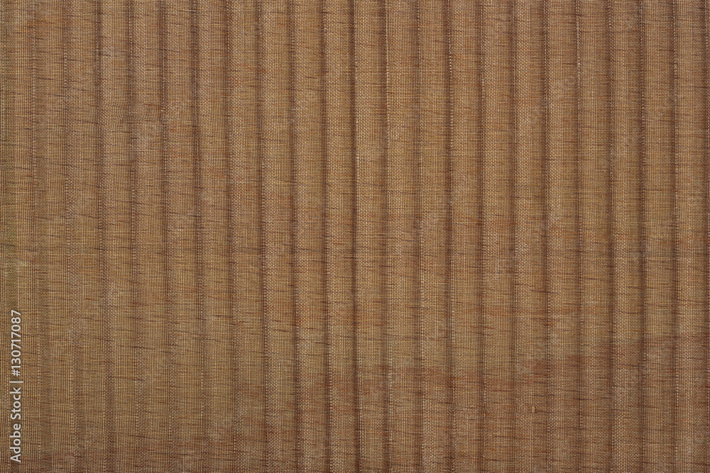 Black pleated transparent caprone cloth on a brown background Black pleated transparent caprone cloth on a brown background