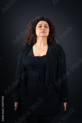 Beautiful woman doing different expressions in different sets of clothes: at attention