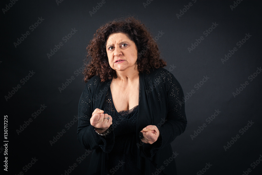 Beautiful woman doing different expressions in different sets of clothes: angry Beautiful woman doing different expressions in different sets of clothes: angry