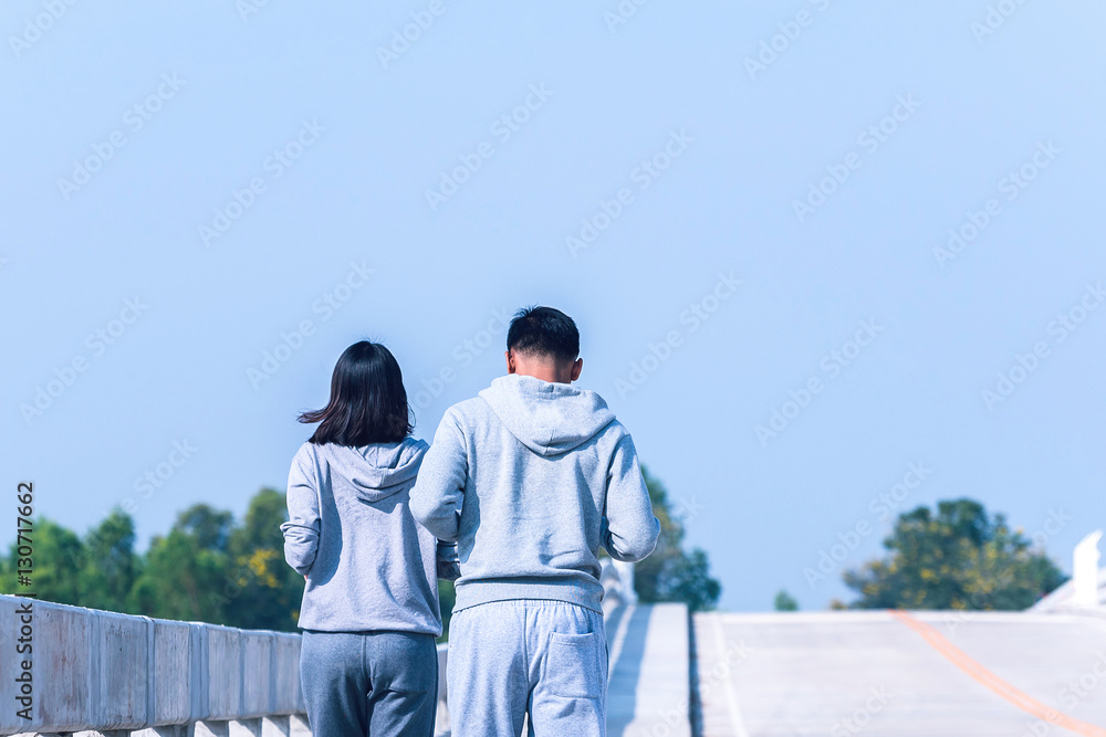 smart couple running on bridge. Healthy lifestyle love couple of cardio together in outdoors.
smart couple running on bridge. Healthy lifestyle love couple of cardio together in outdoors.