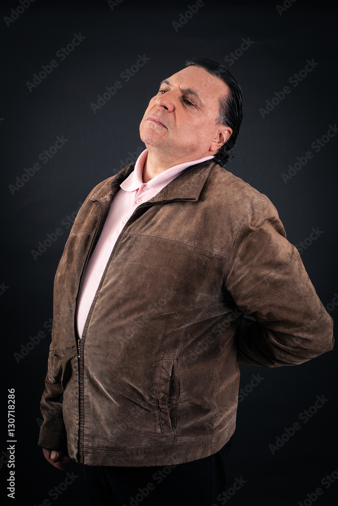 Fototapeta premium Handsome Man doing different expressions in different sets of clothes: backache