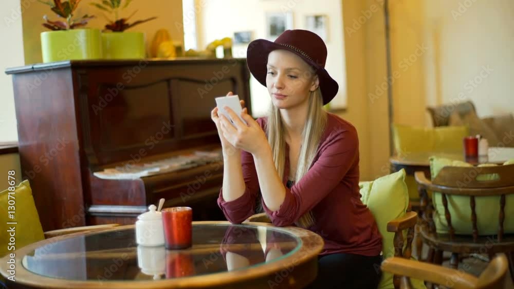 Girl in retro clothes browsing internet on smartphone, steadycam shot
Girl in retro clothes browsing internet on smartphone, steadycam shot