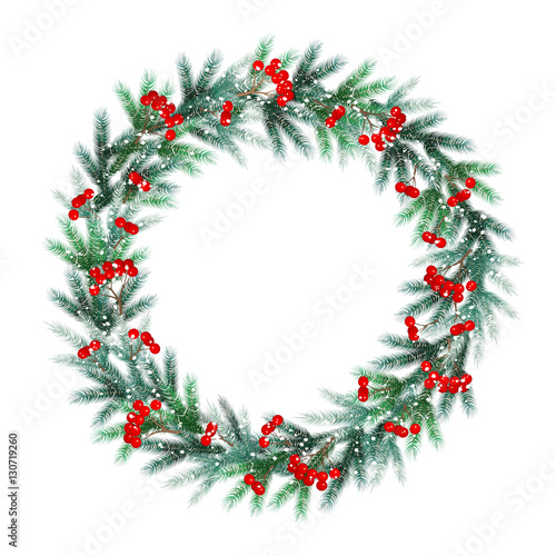 Christmas wreath of fir branches with frost, snow and red berrie