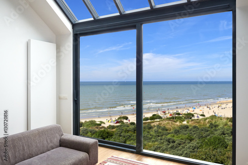 Room with large windows and view on seaside © pbombaert