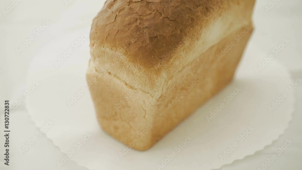 Close up of wheat bread on the white background in 4K Close up of wheat bread on the white background in 4K
