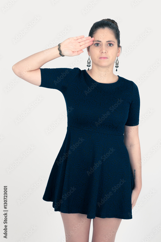 Beautiful woman doing different expressions in different sets of clothes: at attention Beautiful woman doing different expressions in different sets of clothes: at attention