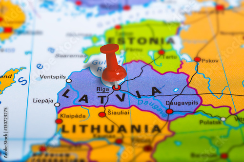 Riga Latvia pinned on colorful political map of Europe. Geopolitical school atlas. Tilt shift effect.