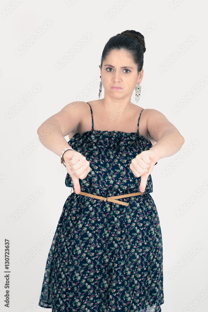 Beautiful woman doing different expressions in different sets of clothes: thumbs down Beautiful woman doing different expressions in different sets of clothes: thumbs down