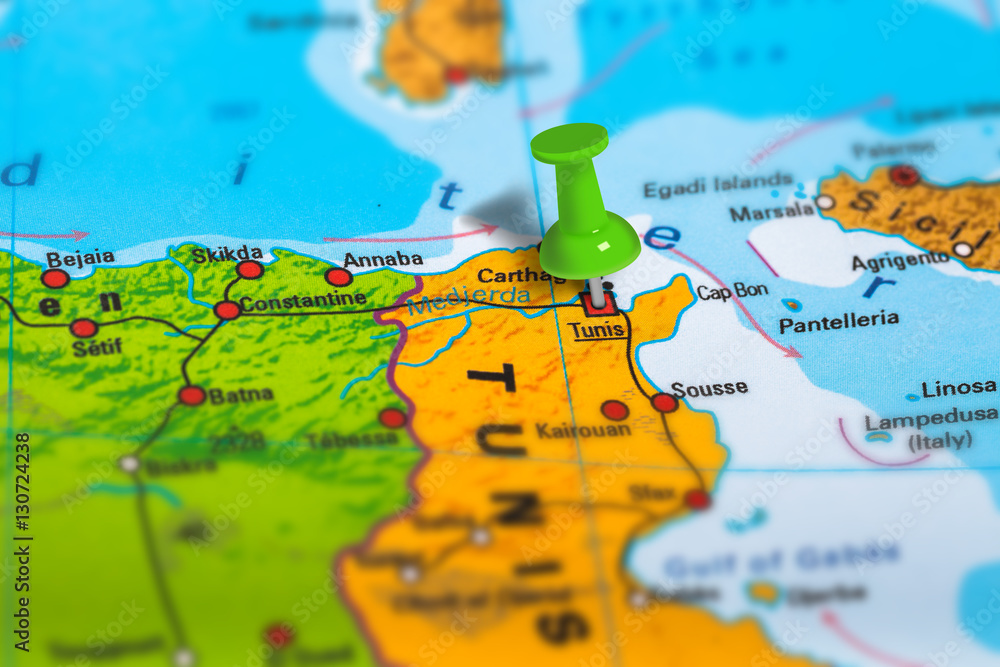 Naklejka premium Tunis capital city in Tunisia pinned on colorful political map of Africa. Geopolitical school atlas. Tilt shift effect.