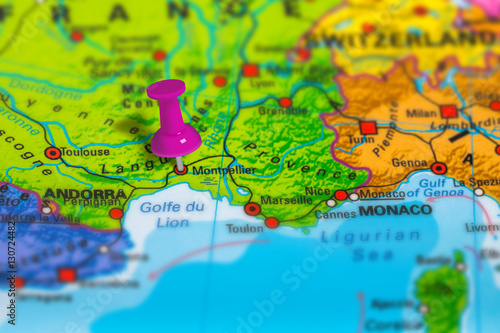 montpellier in France pinned on colorful political map of Europe. Geopolitical school atlas. Tilt shift effect.