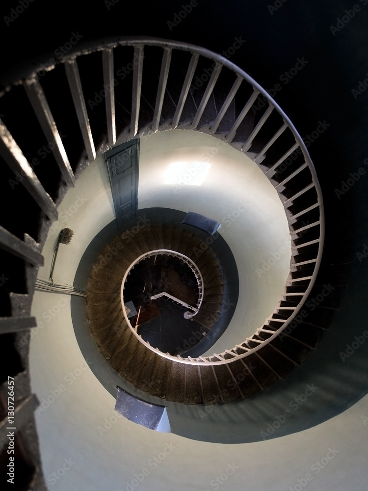 Upside view into the spiral of a lighthouse