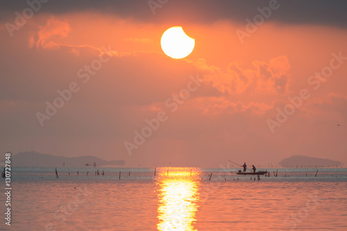 Solar eclipse (partial) at the Lampam  lake shore ,Phatthalung province, Thailand.