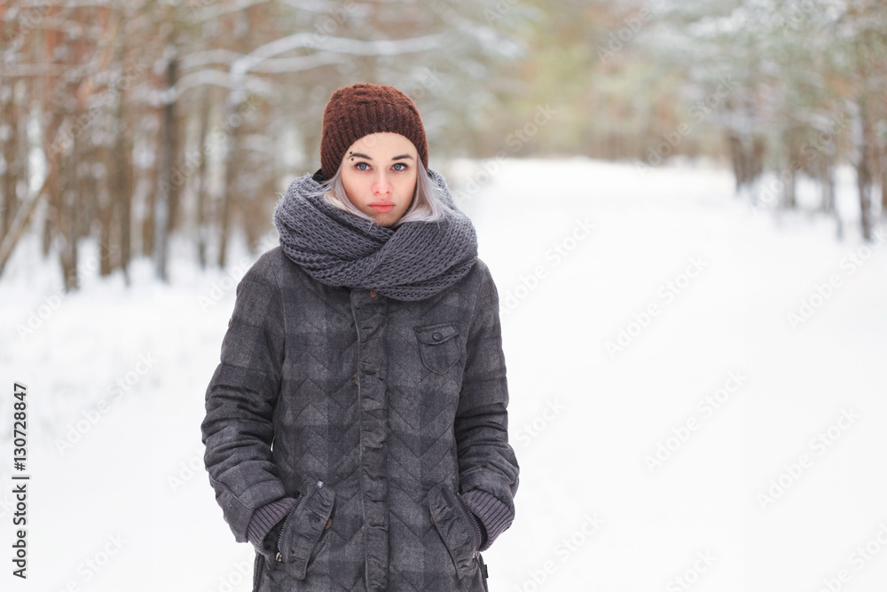girl in the winter woods on a snowy road girl in the winter woods on a snowy road