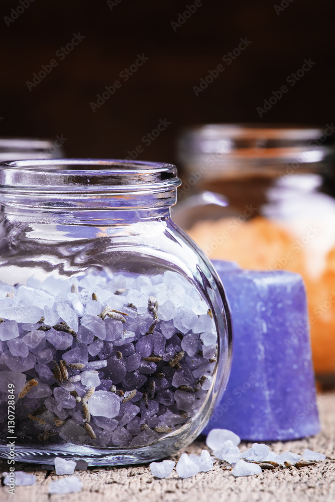 Blue lavender bath salts in a glass jar, rustic style, selective Blue lavender bath salts in a glass jar, rustic style, selective