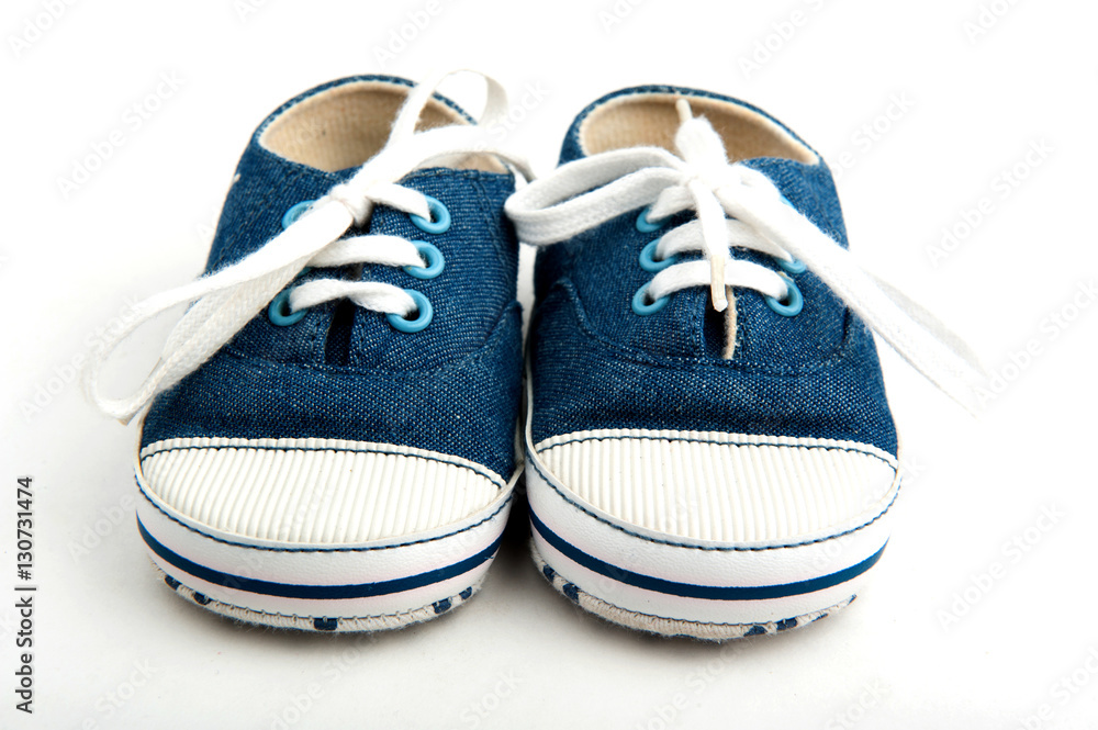 baby sneakers on white background